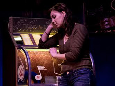 An actress performing in Solo Club at Theater Bartlesville