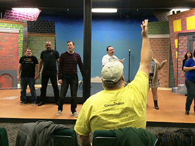 Volunteers practice for the Theater Bartlesville performance of Little Shop of Horrors